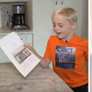 boy gives money to teacher